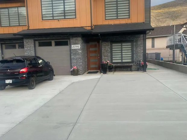 The house at 2791 Westsyde Road, with the driveway and parking area out front