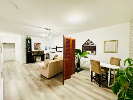 The main room looking toward the wooden screen and shelving