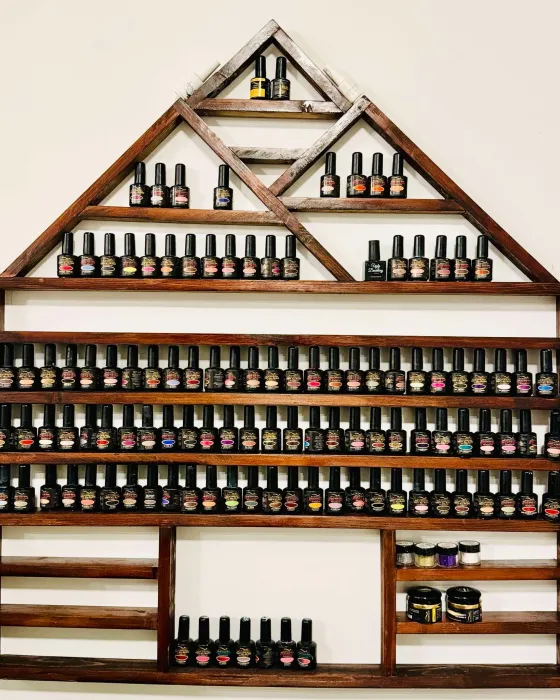 The polish wall in the studio, a house shaped wooden rack filled with rows of Bio Seaweed Gel colours